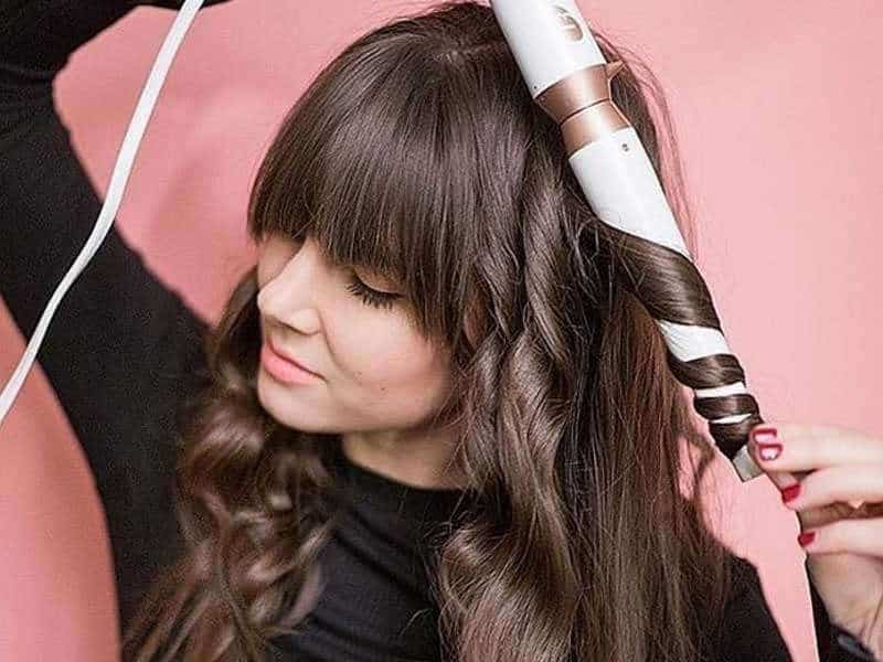 Girl with curling iron