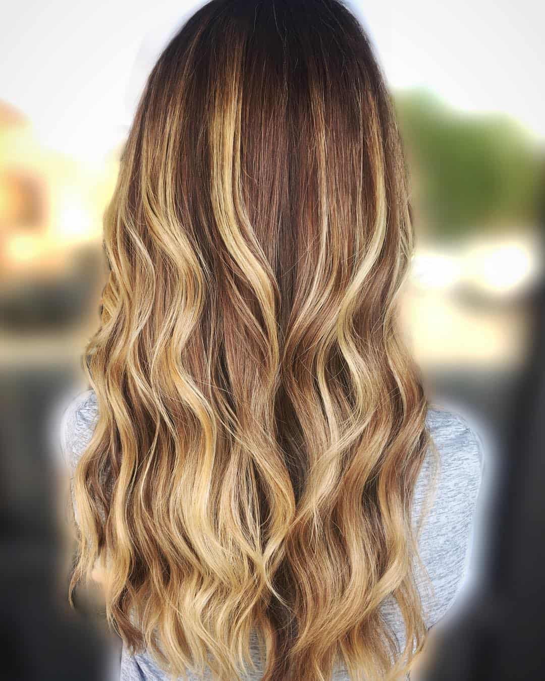 Brown With Red Undertones And Honey Beach Blonde Highlights