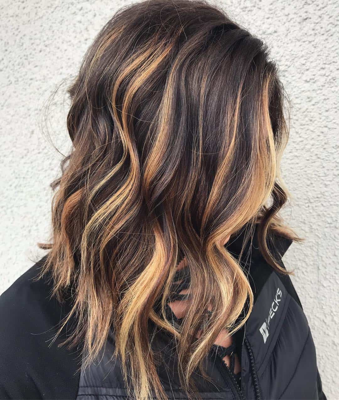 Wavy Brunette With Chunky Sunflower Blonde Highlights