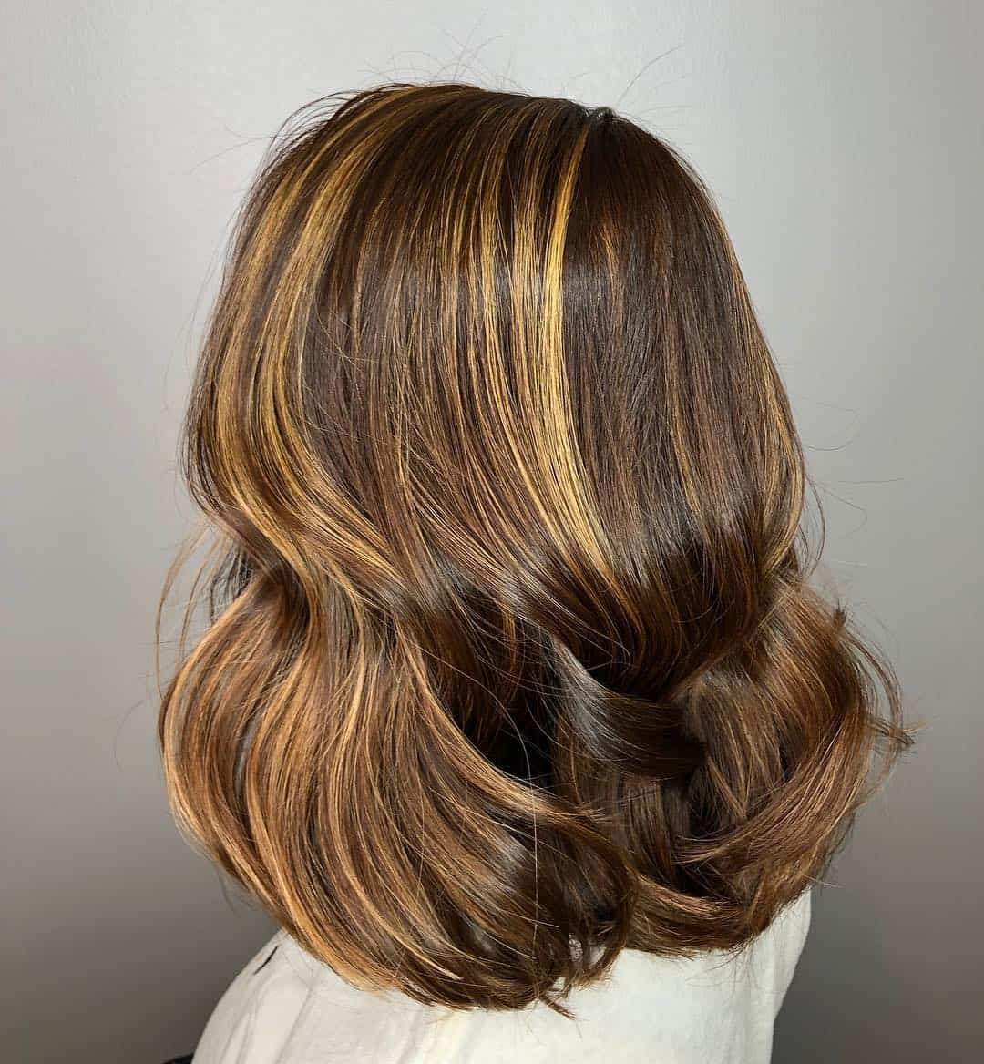 Medium Lenght Chestnut Brown With Bight Caramel Highlights