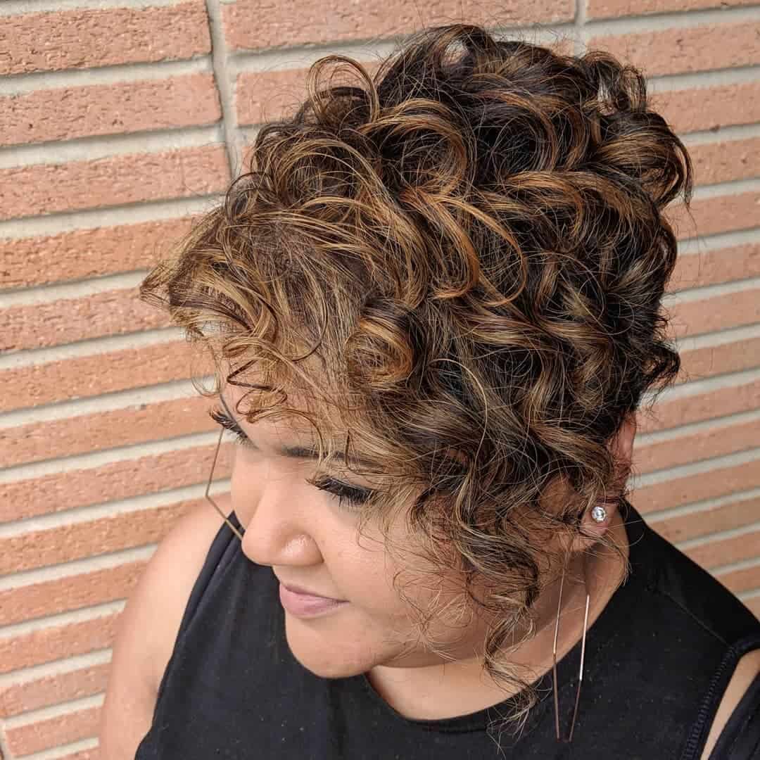 Short Spiraling Curls With Light-Toned Caramel Highlights