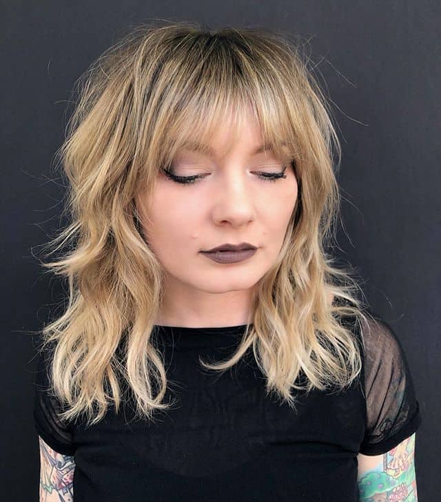 Blonde Shaggy Cut With Feather Bangs