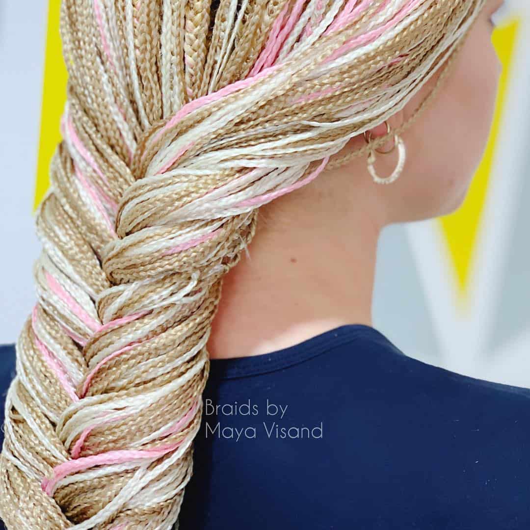 Picture of a woman wearing a large chunky braid around the crown of her head