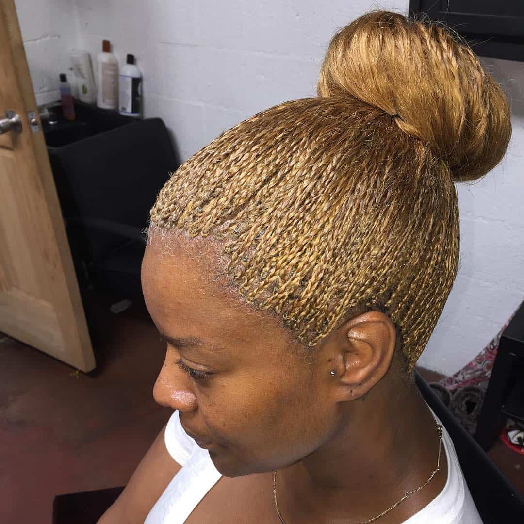 Golden Micro Braids In Loose High Bun