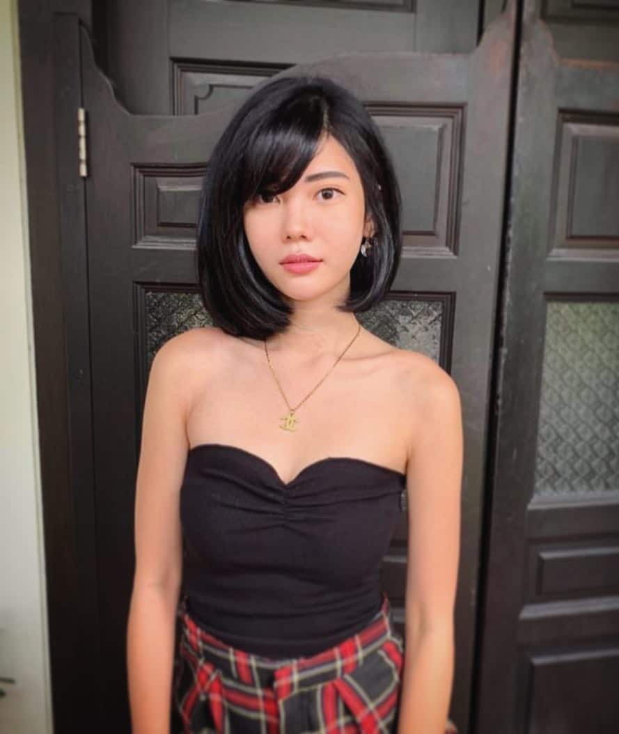 Slick Black Bob With Gray Peekaboo Streaks And Side Bangs