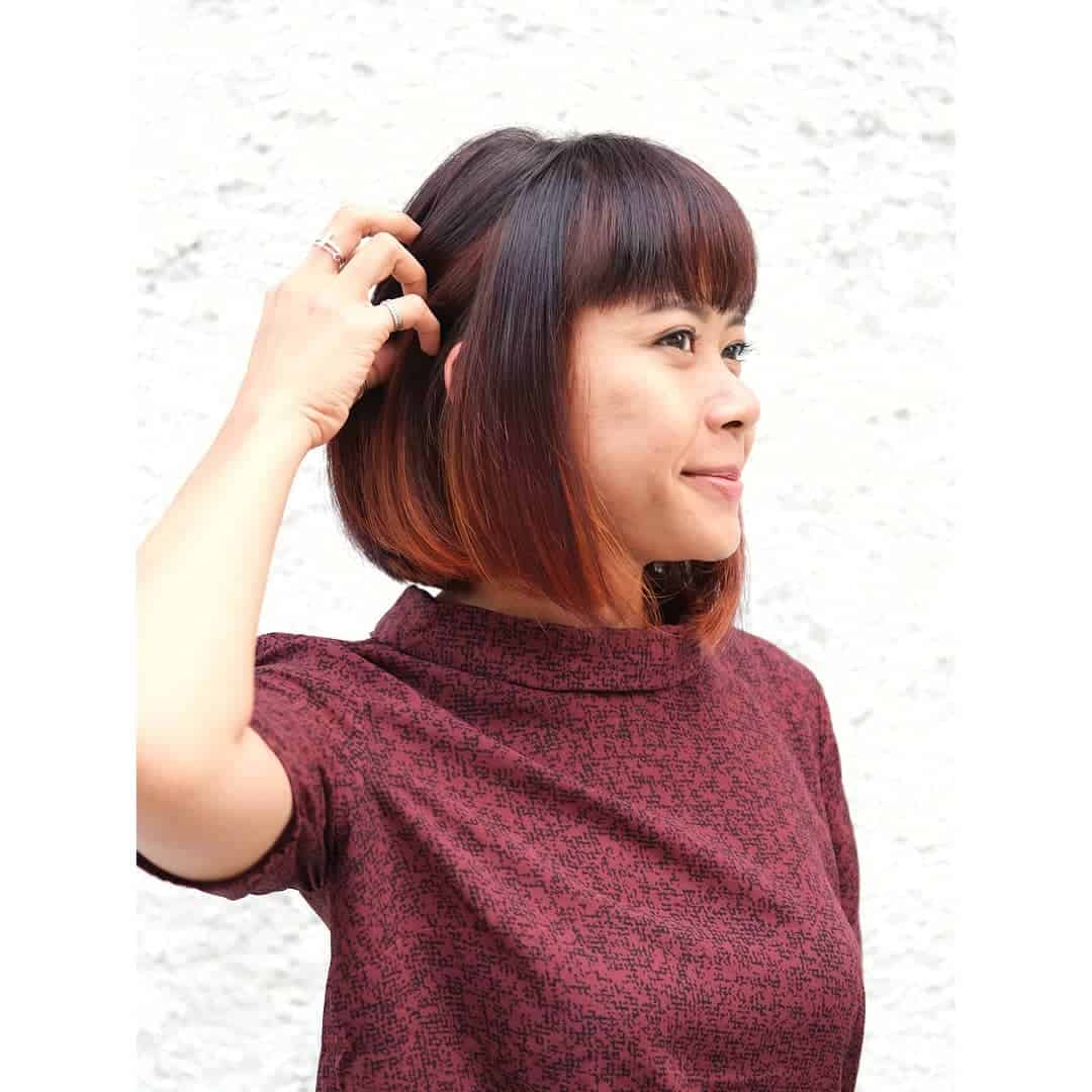 Dark Brown Bob With Orange Peekaboo Highlights