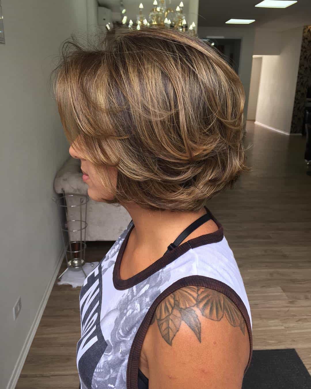 Brown With Caramel Highlights On Layered Blown-Out Bob