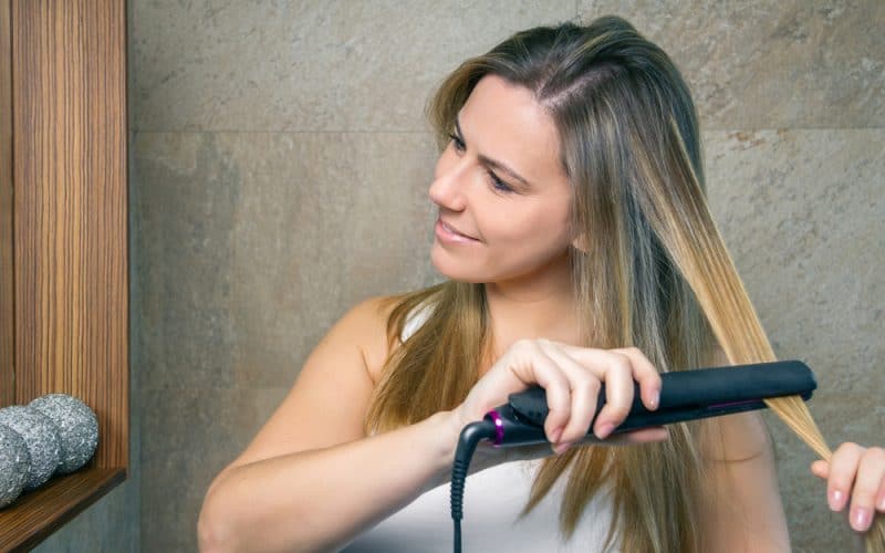 girl with hair straightener