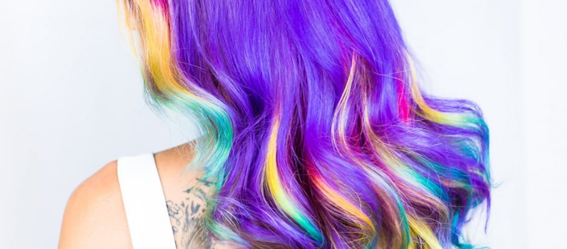woman in white top with multicolored hairstyle
